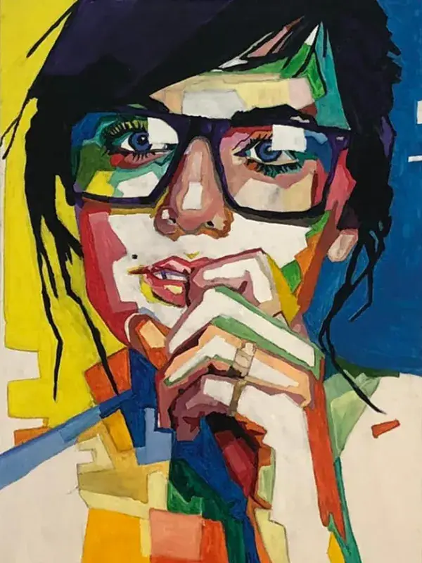A geometric pop-art oil portrait of a woman with large black glasses and blue eyes, fingers at her lips in thought, her face built from blocks of colour against a background split between yellow and deep blue, wild black hair framing it.